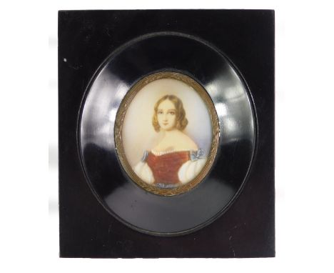 A 20thC watercolour miniature, half length portrait of a lady, in a black ebonised frame, 13.5cm x 11.5cm.