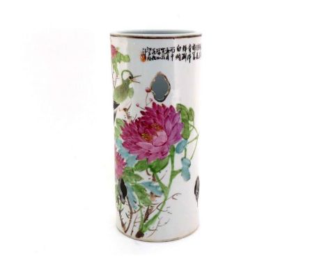 A Chinese famille rose vase of cylindrical form, pierced on both sides with three small quatrefoil apertures around painted g