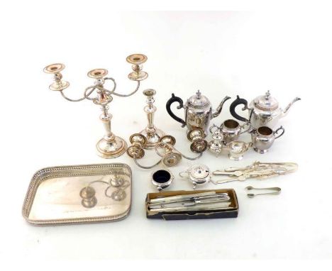 A group of silver plate comprising:- a 4-piece tea 7 coffee set with floral rims; a pair of 3-light candelabra with bead bord