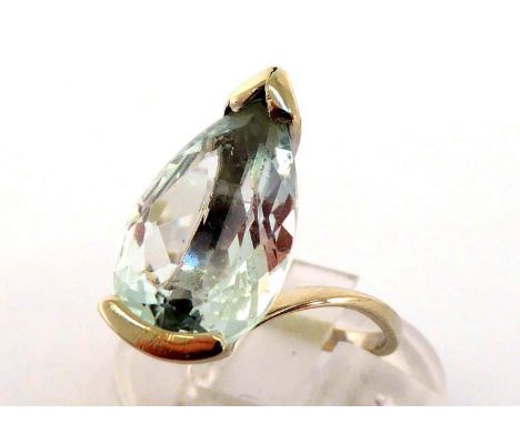 An aquamarine dress ring, the pendeloque cut stone 6 x 9.9mm, in a white metal mount (tests 18 carat gold), finger size K/L, 