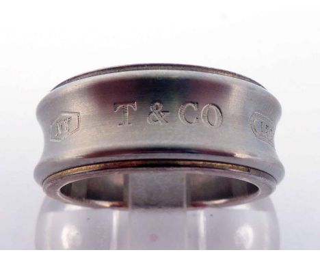 Tiffany & Co, a silver ring, signed inner and outer shank, finger size K/L, 6.9gms CONDITION: good 