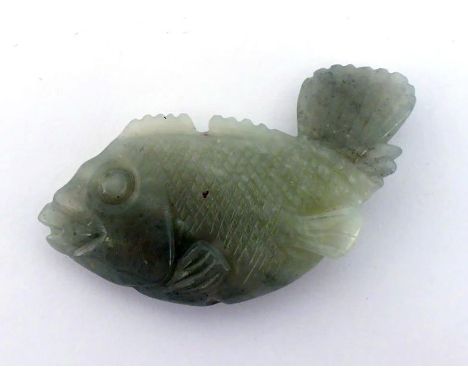 A Chinese celadon jade pendant carved as carp, 19th/20th century, in good condition. 