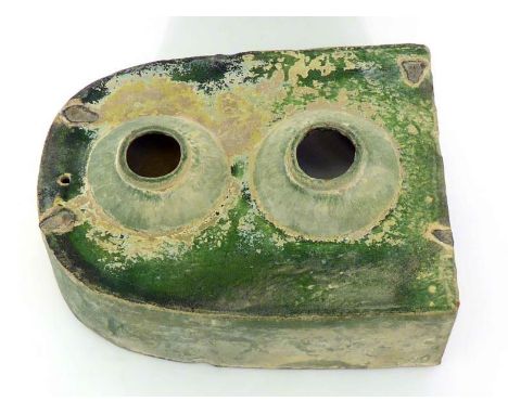 An unusual partly iridescent green glazed ceramic piece with enclosed spherical compartment and separate open hemispherical  