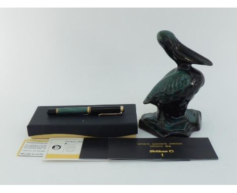 Pelikan, Souveran, a black and striated green marble resin fountain pen, with fine nib and piston filler mechanism, in a Peli