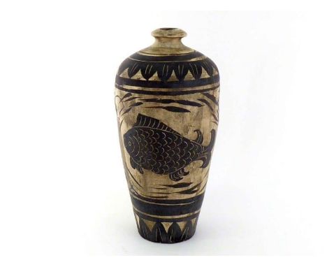 A Chinese ceramic 'Cizhou' ware vase, in  the form of Meiping, brown glaze decorated with fish and lotus in the centre and le