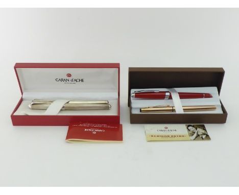 A collection of pens, including two Cross rollerball pens, a Caran D'Ache hexagonal section silver plated fountain pen, and a