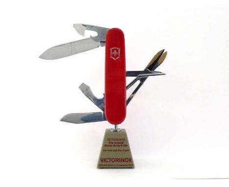 A VIctorinox shop display model Swiss army Knife, the blades electrically powered to open and shut continuously. In good over