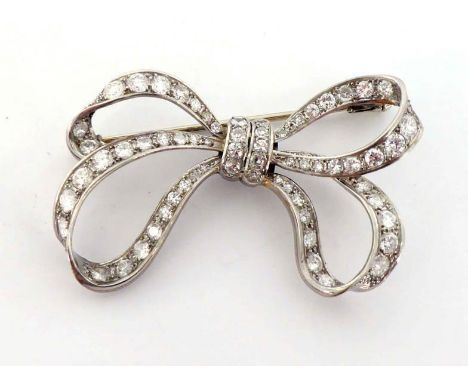 A diamond bow brooch, set overall with brilliants and single cuts, mounted in white gold (pin stamped with obscured marks), 5