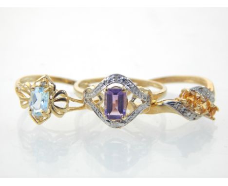Three 9ct yellow gold rings set topaz, diamond citrine and amethyst
