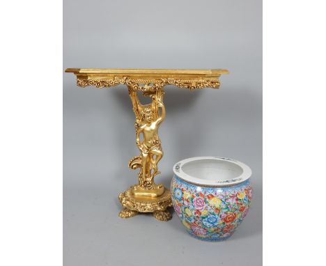 Rococo style gilt painted console table, the glazed and moulded top with floral apron over cherub support, on circular base w