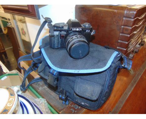 A Minolta camera in case inc. lenses film etc.