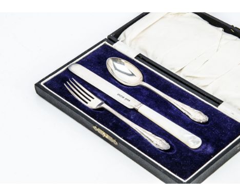 A 1920s silver three piece Christening set, in fitted box, spoon and fork with initials EH 