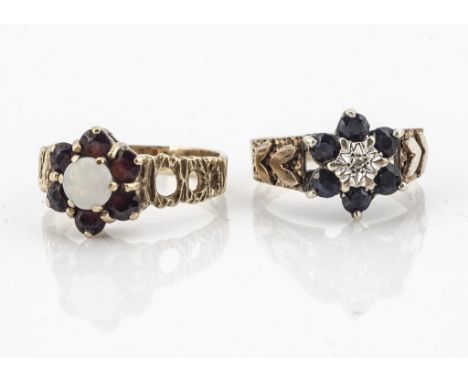 Two cluster rings, comprising an illusion set diamond and sapphire example, ring size M and a garnet and opal cluster, ring s