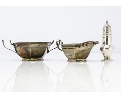 An Art Deco period silver milk jug and sugar basin by Walker &amp; Hall, hexagonal with applied handles, together with a 1960