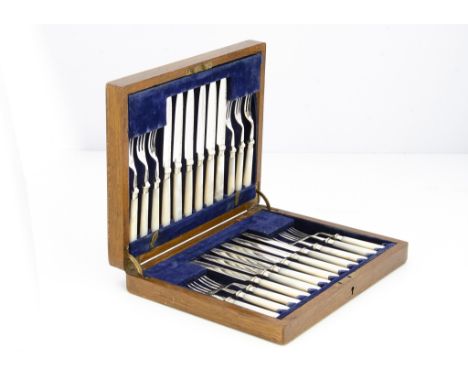 A collection of silver and silver plate, including a cased set of 12 mother of pearl and plated dessert knives and forks, a p