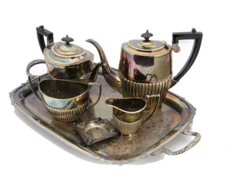 A collection of silver plate, including a twin handled tray, four piece tea set, sugar scuttle, bon bon dish and flatware 