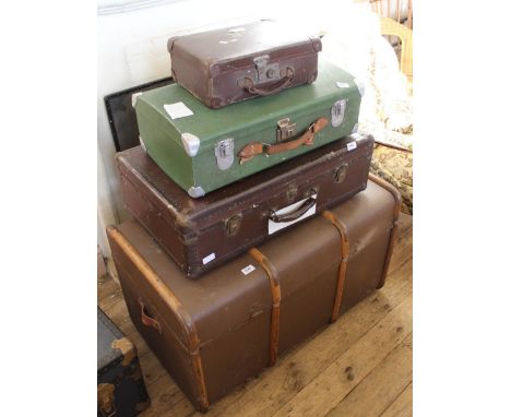 Three travelling cases and a large steamer trunk