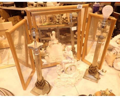 Triptic dressing table mirror with two column lamps and figural clock  CONDITION REPORT: All electrical items in this lot hav