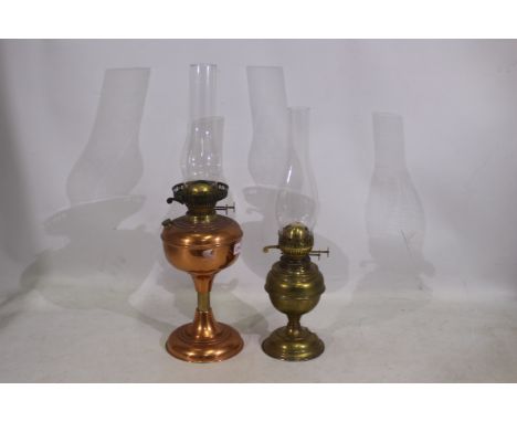 Two vintage brass and copper oil lamps. Lot includes a brass Duplex oil lamp and a copper and brass oil lamp with no maker ma