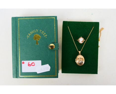A 9ct gold photograph locket and chain and a yellow metal cameo ring stamped 9ct, approximately 4.1 grams. [W]