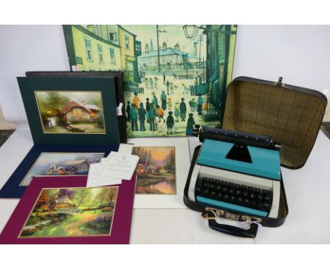 Lot to include a collection of Thomas Kinkade prints, a L S Lowry print on board, 46 cm x 61 cm and a portable typewriter. [3