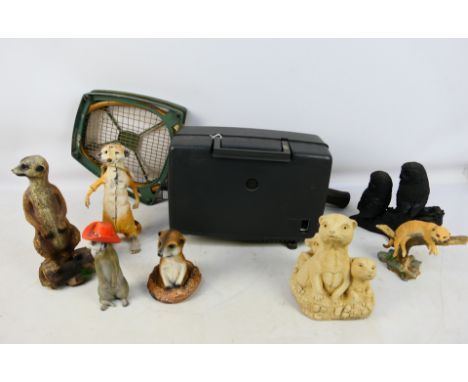 Lot to include a vintage tennis racket, Sankyo Dualux 8 projector, animal figures, predominantly meerkats. [W]