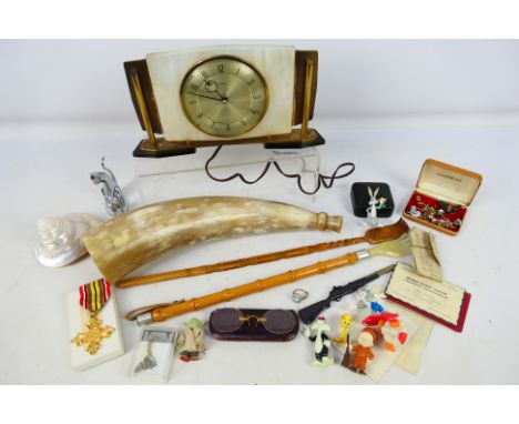 Two vintage back scratchers, a Metamec clock, yellow metal pince-nez and other. [W]