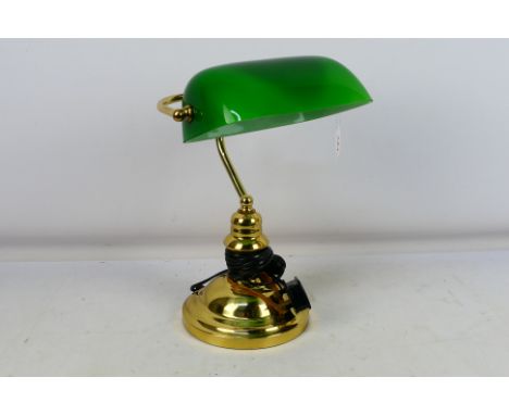 A Bankers desk lamp (60 Watt max) with green glass shade. 38cm tall. Appears very good. (This does not constitute a guarantee