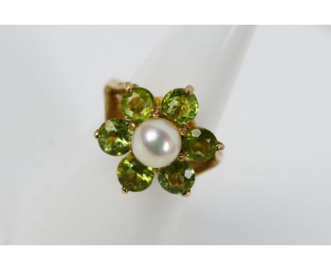 A 9ct yellow gold, pearl and peridot cluster ring, size L, approximately 4 grams. [W]