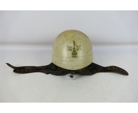 A vintage Trackstar type racing helmet, interior label for Protective Cromwell Headware, decal to the rear Isle Of Man TT Rac