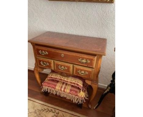 A side table with one long drawer over three short, raised on cabriole supports, approximately 70 cm x 40 cm x 70 cm. [W]

NO