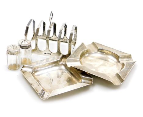 A George V silver four division toast rack, Sheffield 1934, George VI silver ashtray with engine turned decoration, Sheffield