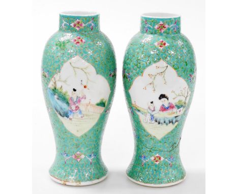 A pair of Chinese Republic famille rose porcelain vases, of baluster form, decorated with reserves of a mother and child in a