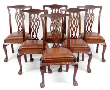 A set of six early 20thC Chippendale style mahogany single dining chairs, with leatherette drop in seats, raised on cabriole 