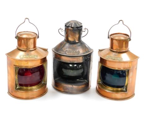 A pair of copper and brass ship's port and starboard lamps, and a further starboard lamp.  (3)