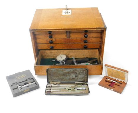 A Moore and Wright oak engineer's chest, the lockable front opening to reveal two short over three long graduated drawers, wi