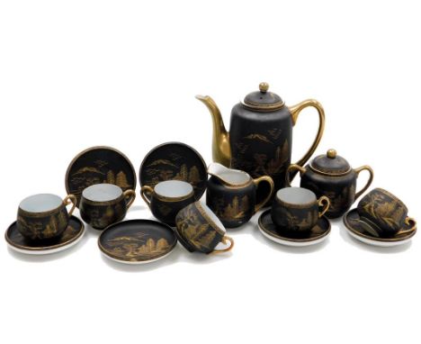 A Japanese porcelain coffee service, decorated in gilt on a brown ground, comprising coffee pot, sucrier and cream jug, six c