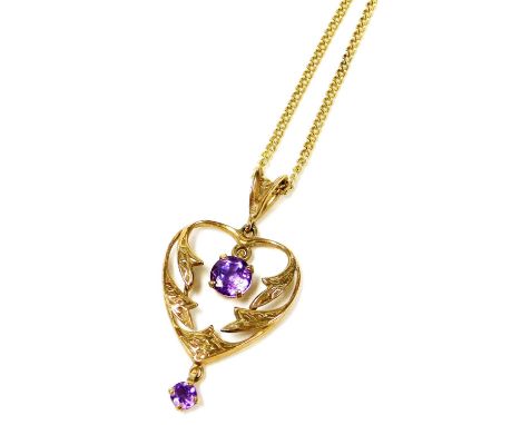 An Art Nouveau style 9ct gold and amethyst heart shaped pendant, 2.8g, on a curb link neck chain, with a bolt ring clasp. 