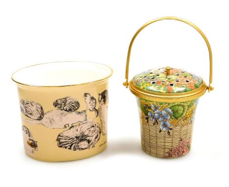 A Halcyon Days enamel pot pourri, modelled as a flower basket, with ring handle, gilt heightened, 8cm high, boxed, together w