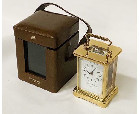 MATTHEW NORMAN CARRIAGE CLOCK - NOT RUNNING IN ORIGINAL LEATHER CASE WITH KEY 12CMS (H) APPROX WITH HANDLE LAYING FLAT