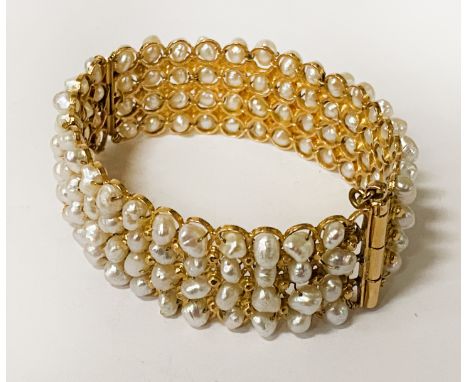 GOLD & FRESHWATER PEARL CUFF BANGLE 59.1 GRAMS APPROXWe think that the carat is about 18 however we are uncertain of the exac
