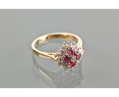 RUBY AND DIAMOND CLUSTER RING
set with four rubies surrounded by brilliant cut diamonds, hallmarked for eighteen carat gold, 