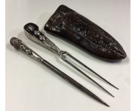 A cased 17th / 18th Century silver travelling fork together with another piece. Approx. 201 grams of gross weight. Est. £300 