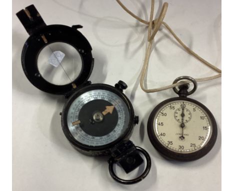 A small gun metal stopwatch together with a compass. Est. £20 - £30.