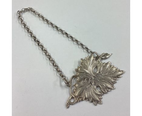 A Naturalistic silver wine label for 'Gin'. Circa 1840. Approx. 12 grams. Est. £20 - £30.