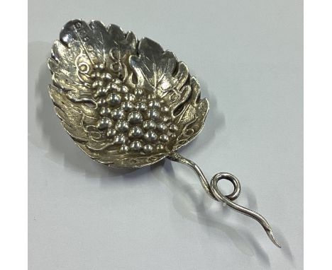 A Naturalistic Victorian silver caddy spoon with grape and vine decoration. Birmingham 1847. Probably by Joseph Wilmore? Appr