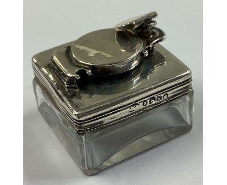 An Antique silver mounted and glass inkwell. London 1836. Est. £100 - £150.