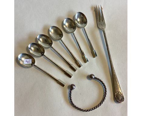 A set of six silver coffee spoons together with a pickle fork etc. Various dates and makers. Approx. 99 grams. Est. £20 - £30