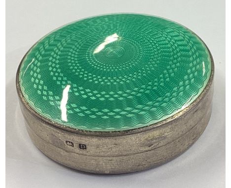 A silver and green enamelled compact. Birmingham 1927. Approx. 41 grams. Est. £100 - £150.
