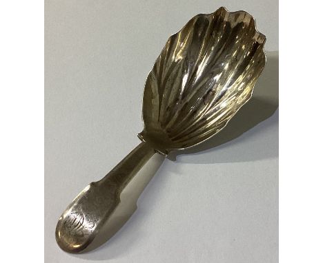A fluted silver caddy spoon. London 1811. Approx. 13 grams. Est. £30 - £40.